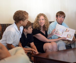 Dr. Cara Kozma, assistant professor of English, and HPU junior Miles Cooper read to children in HPU’s new Community Writing Center.