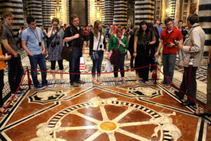 Students view the ‘Ruota della Fortuna’ (Wheel of Fortune) which was laid in 1372 and restored in 1864.