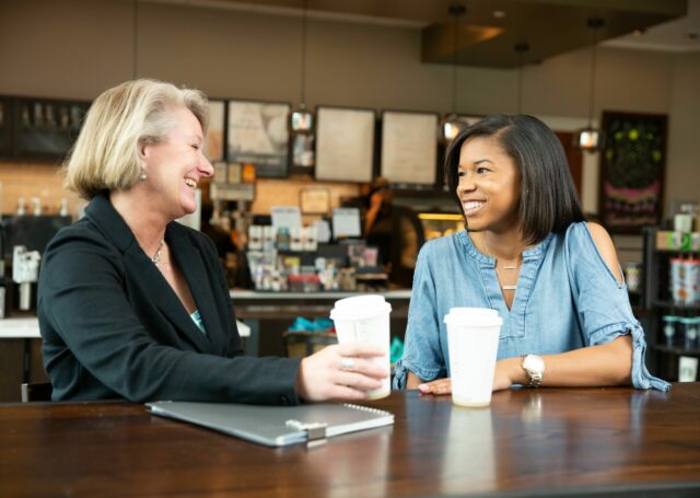 2 women drinking starbucks coffee
