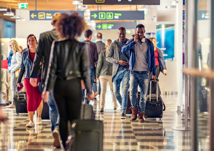group of people walking in airport