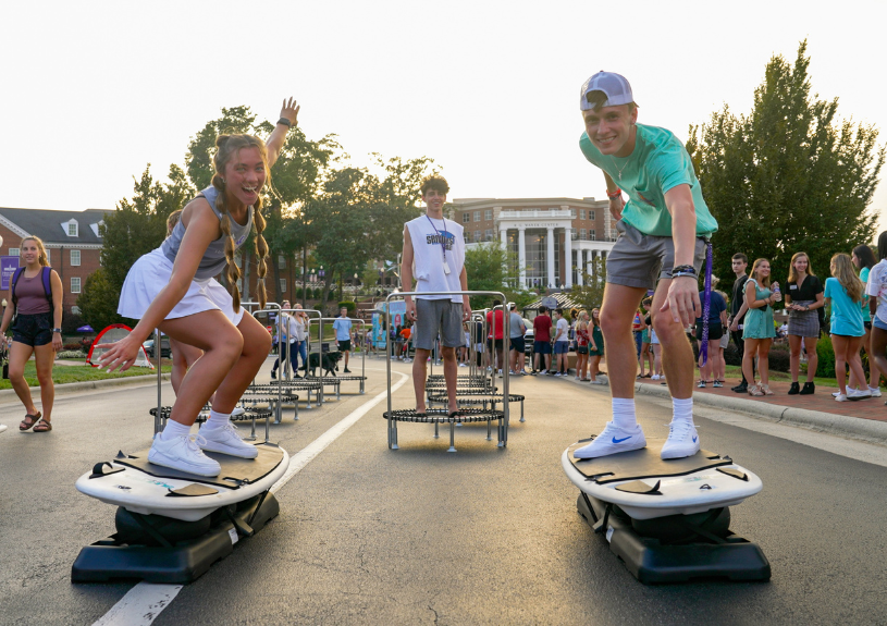 students skateboarding and smiling