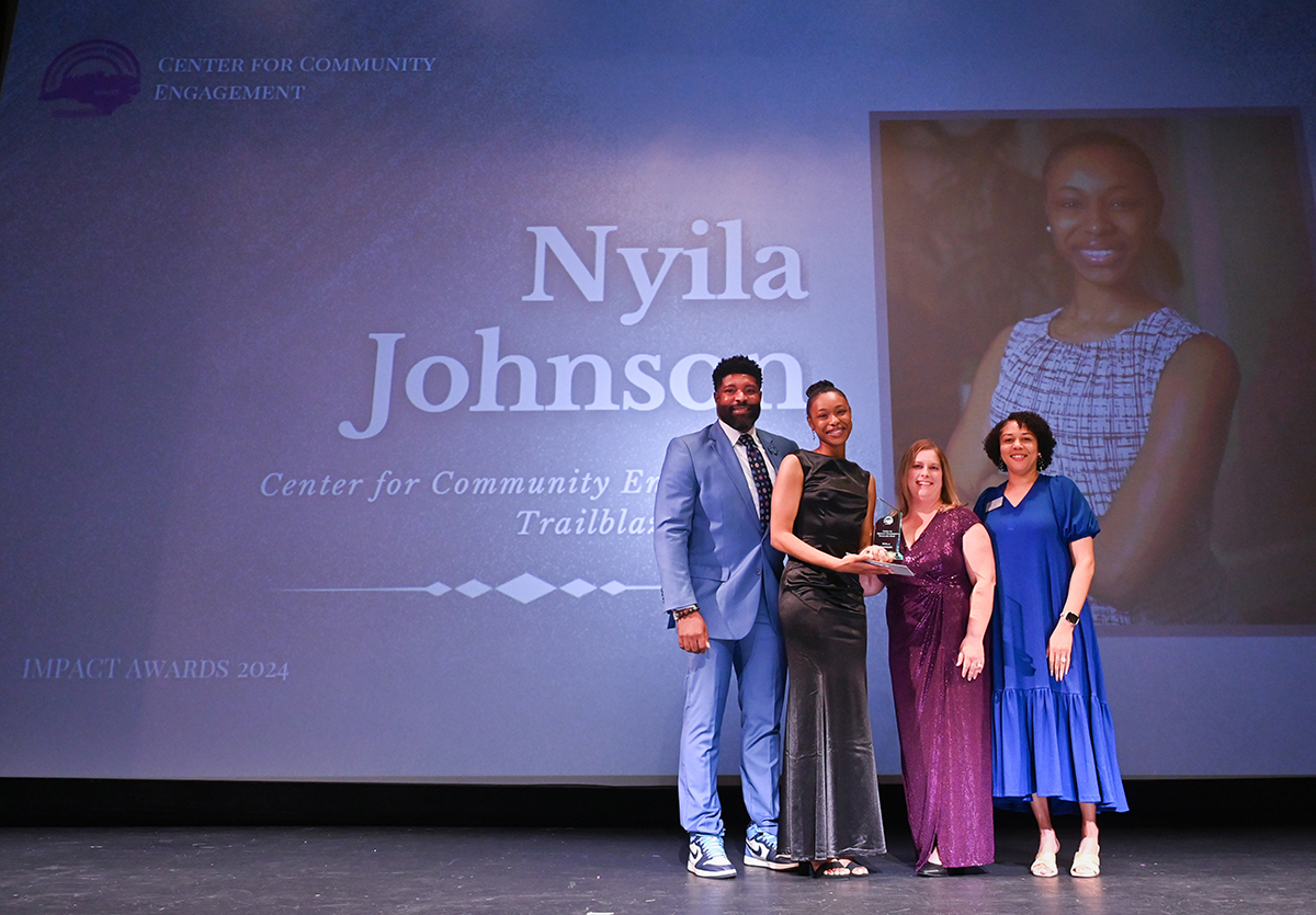 Pictured from left are Lovelle McMichael, CCE assistant director; Nyila Johnson with CCE’s first Community Engagement Trailblazer Award; Jennifer Wagoner, CCE communication specialist; and Kimberly Drye-Dancy, CCE executive director.
