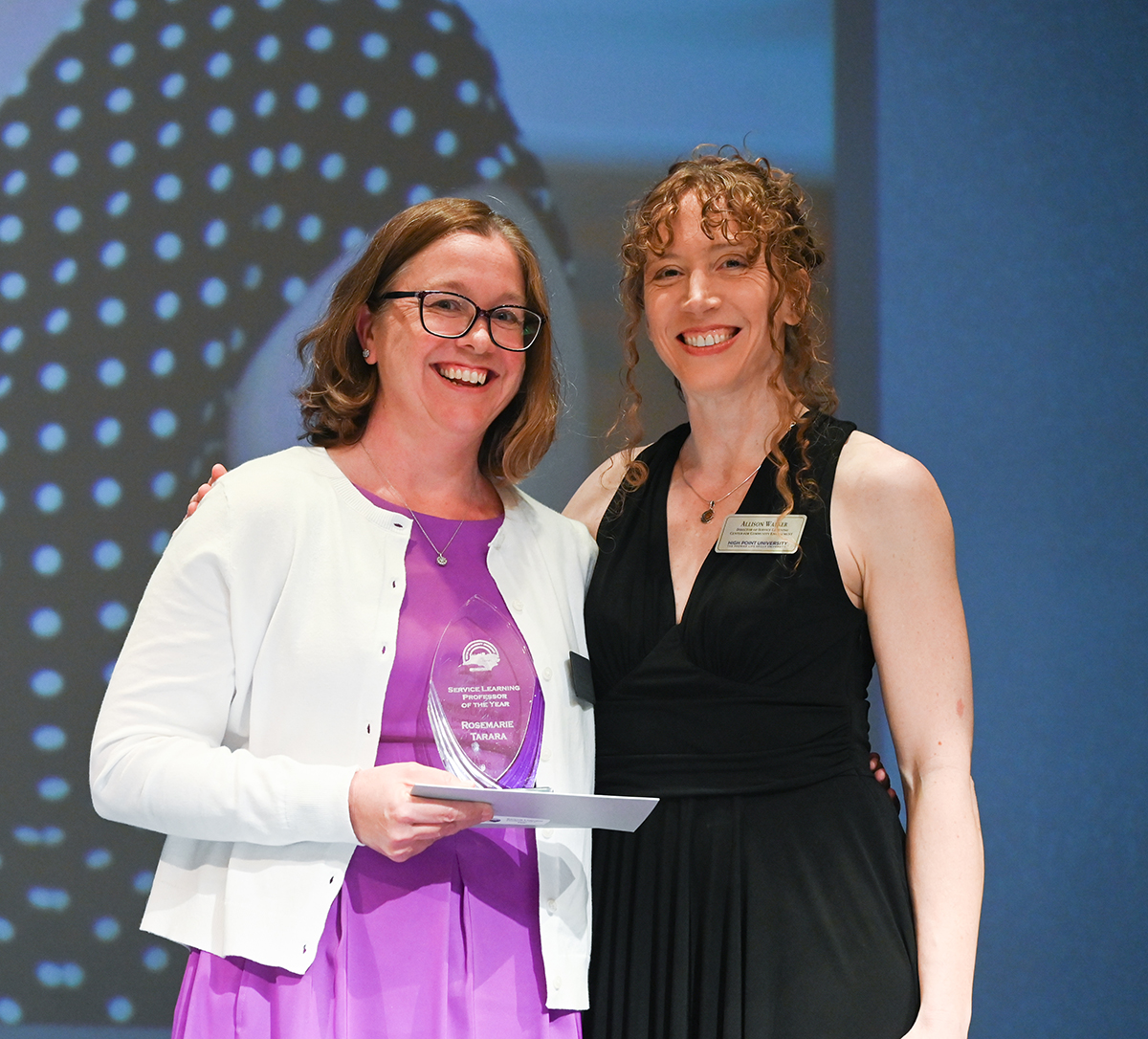 Rosemarie Tarara, instructor of education preparation and director of Education Fellows, was awarded Service-Learning Professor of the Year by Allison Walker, director of service learning and instructor of English.