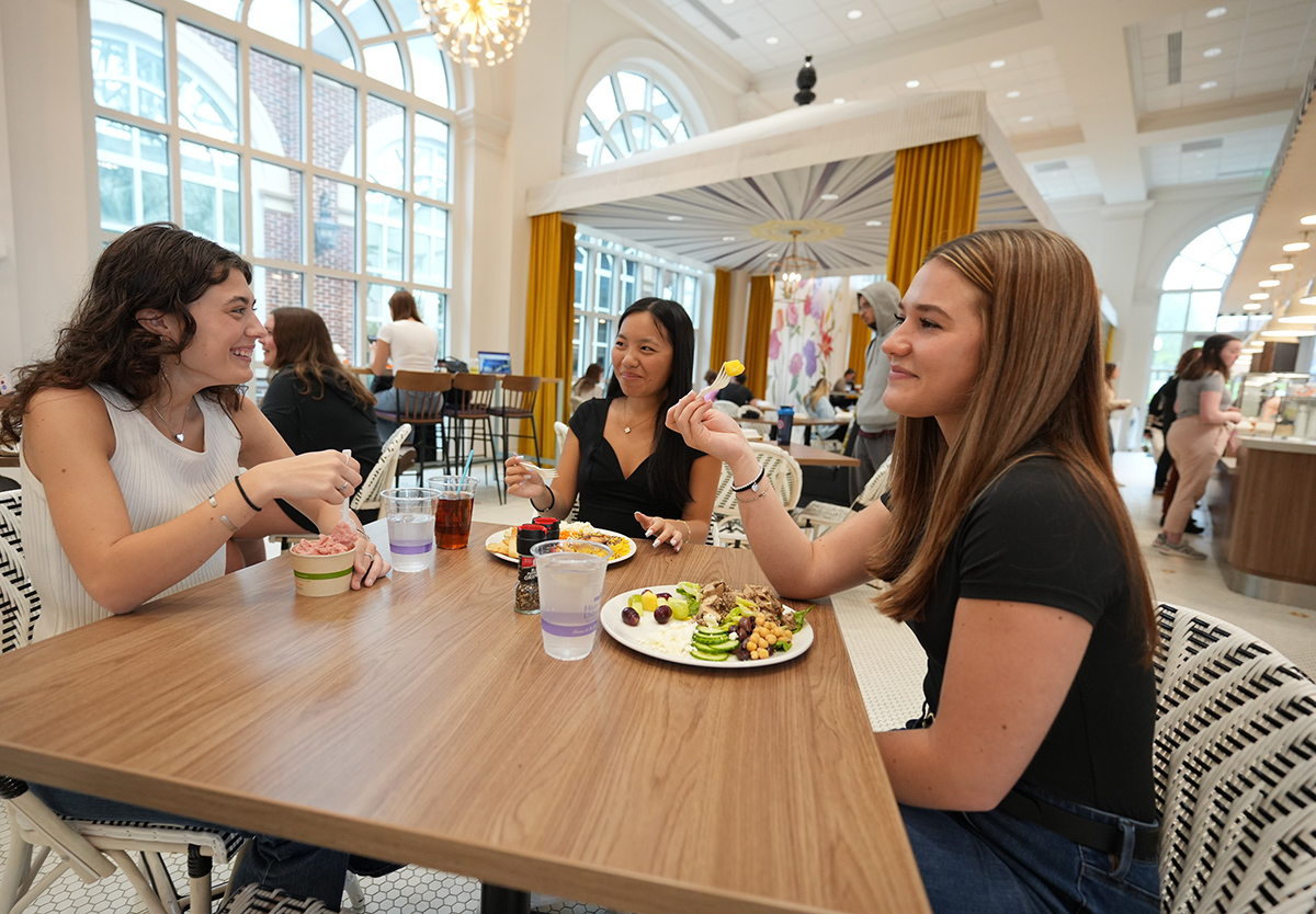 Students smiled as they enjoyed eating at the Butterfly Café, a popular eatery on campus.