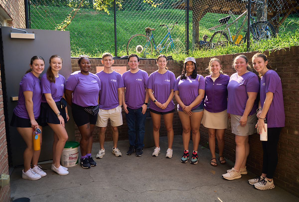 From left, HPU pharmacy students Jacqueline Frate, Jess Moniuszko, T’Nasia Priester, Mason Underwood, Maxwell Crum, Lexie Soteriou, Tiffany Mason, faculty members Dr. Stacey Cutrell and Dr. Sarah Rhodes, and student Nikki Williams paused while volunteering at the food donation site outside Open Door Ministries. 