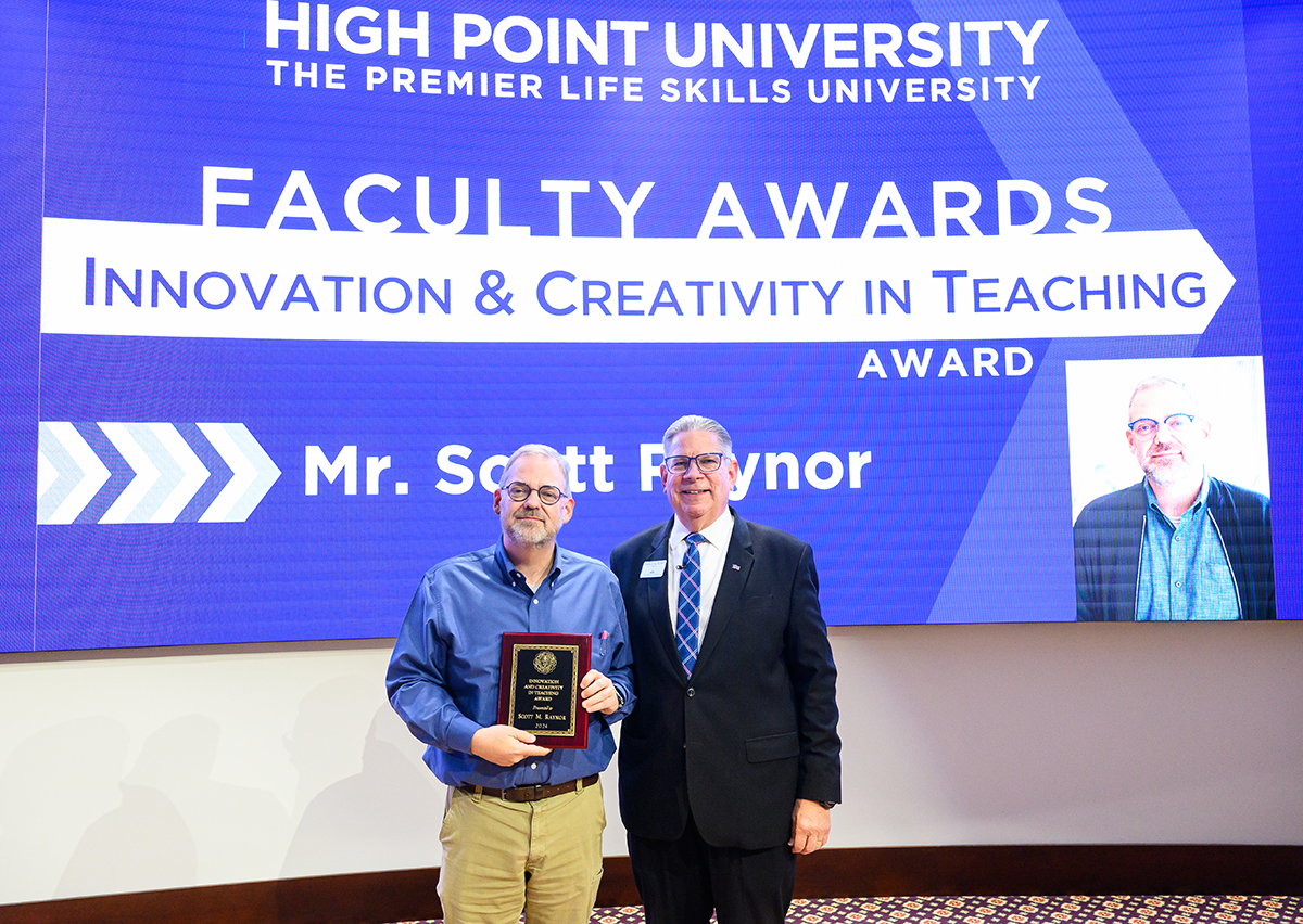Scott Raynor, professor and chair of HPU’s Department of Art and Graphic Design, with the Innovation and Creativity Teaching Award presented by Dr. Daniel Erb, provost.