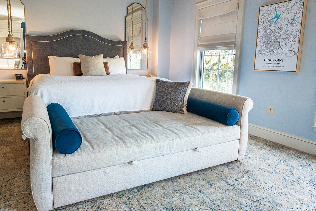 Pictured is a guest room featuring HPU students’ French Country design theme. 