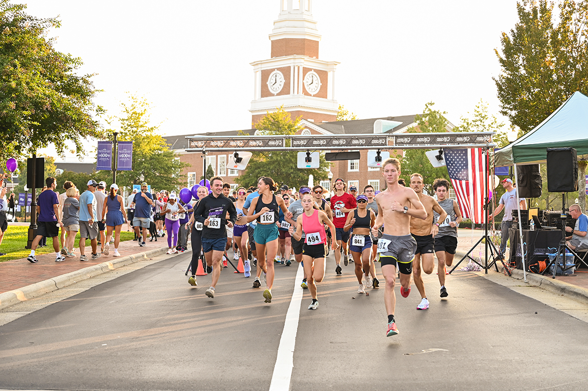 HPU Student Government Association President Ben Niehaus, number 163, and SGA Chief of Staff Caitlin Black, number 162, smiled as they started the 5K family fun run on campus.