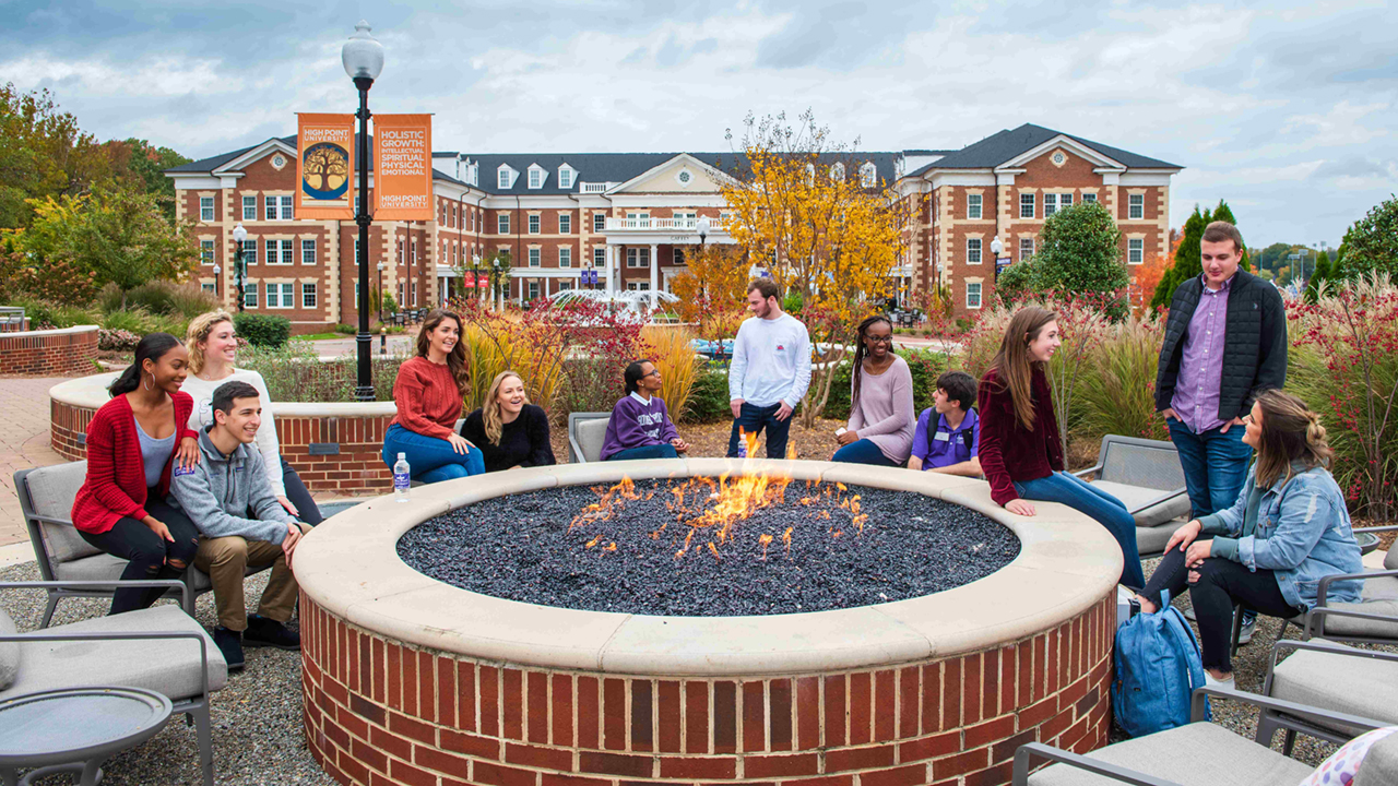22.10.11 students around bonfire high point university in fall you belong here