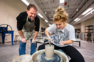 Macy McFerren, ʼ23, works one-on-one with HPU's Artist in Residence Ben Owen III in the Ceramics Studio.