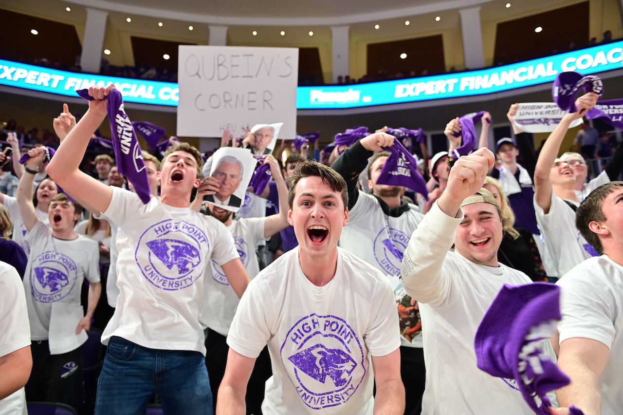 students at basketball game in arena