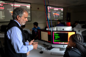 Students and faculty in HPU's cybersecurity lab