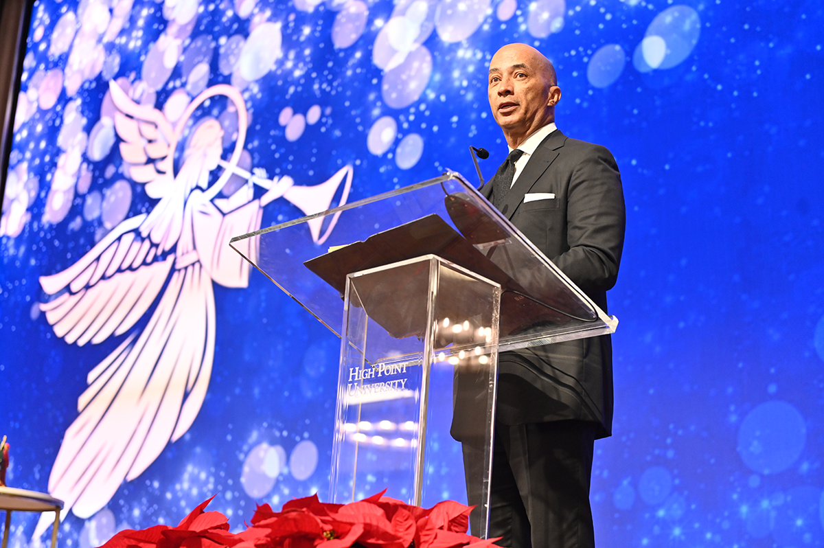 HPU's Journalist in Residence Byron Pitts leads the opening prayer.