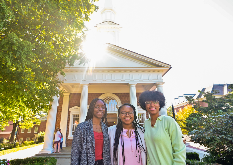 three female students in front of HPU's Hayworth Chapel
