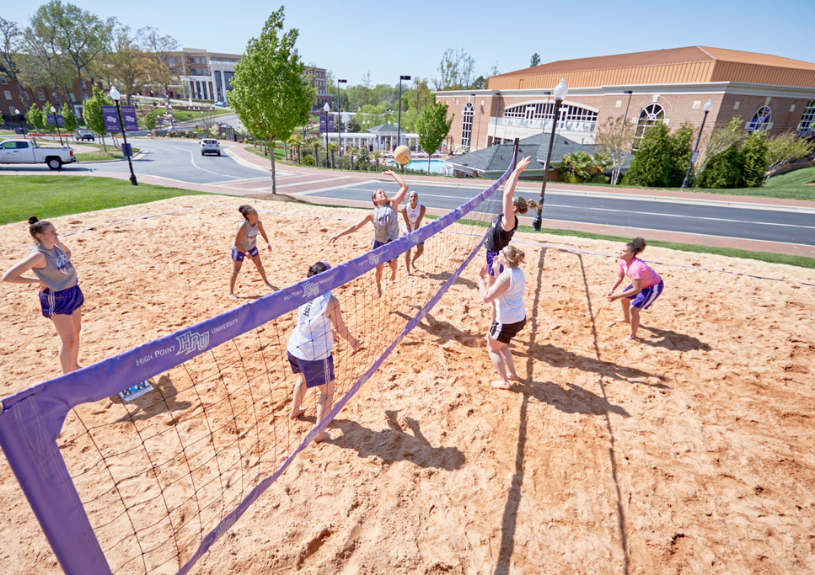 students playing beach volleyball on HPU's campus