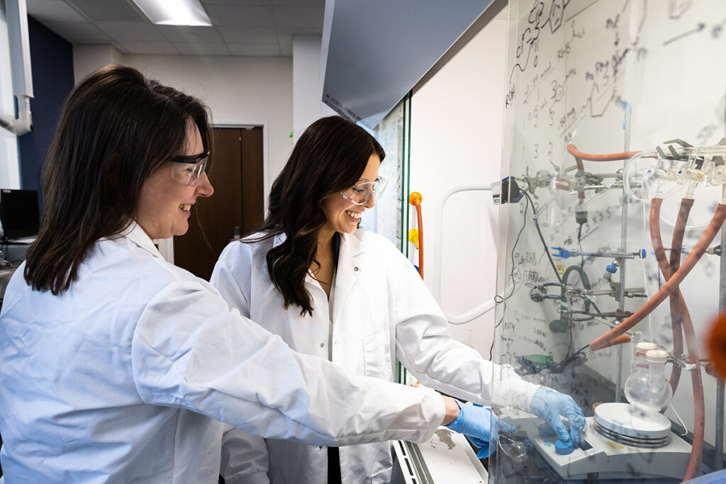 Grace Todd, left, works alongside Dr. Pamela Lundin, assistant professor of chemistry, inside a chemistry lab in the Wanek School of Natural Sciences. 
