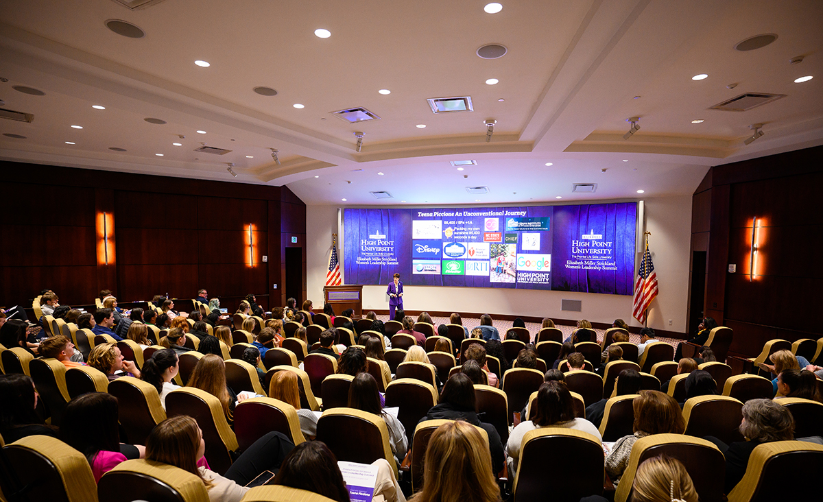 Piccione discussed her business connections with each of the companies shown on the screen behind her.