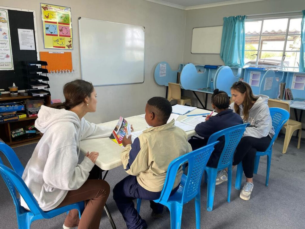 HPU education majors read aloud with children from pre-school and K-12 at Orange Grove Schools (OGS) in Tarkastad.