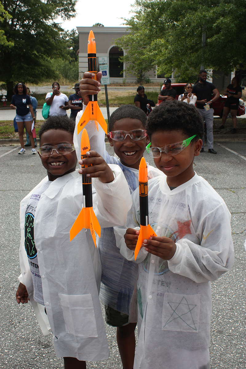 STEM Campers prepare rockets for launch on the final day of camp. 