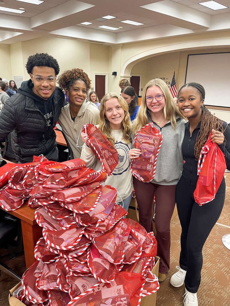Students volunteer to help stuff winter weather items and activities for senior citizens in assisted living facilities and retirement communities.