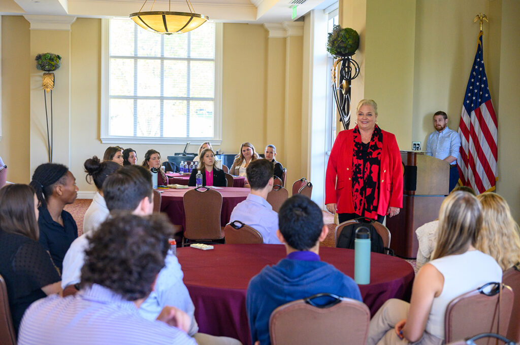 Turner speaks to groups of business and human relations majors on the topic of extraordinary customer service standards.