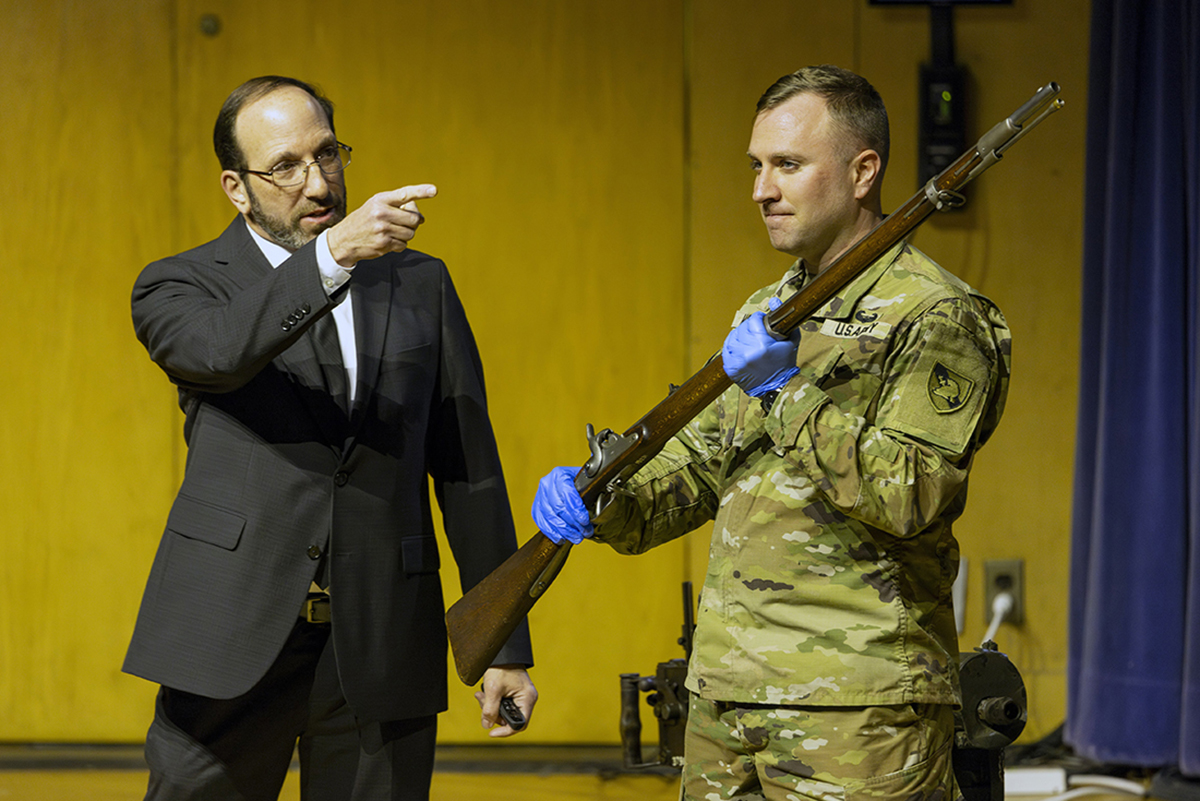 Schneid describes the weapon demonstrated by Capt. Tyler Mazda, a USMA faculty member, during the Ewing Chair lecture to 550 cadets at the U.S. Military Academy (USMA) at West Point.