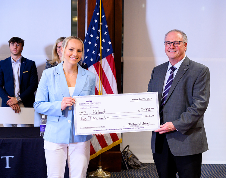 The Rock Star Rookie Award and $2,000 was presented to Maura Malichio, an entrepreneurship major from New York City, New York, for her Retreat app. She is pictured with Gary Simon of Simon Jewelers, who sponsored the award for a second consecutive year.