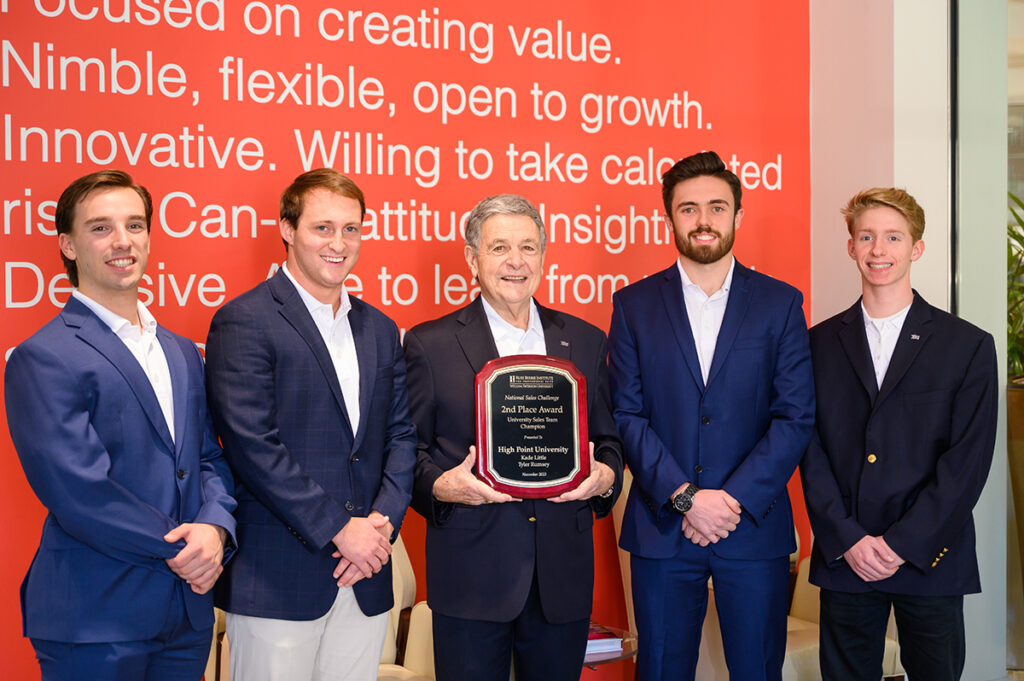 Students from HPU’s Phillips School of Business recently placed second overall out of 30 schools from around the world in the 16th Annual National Sales Challenge (NSC) at William Paterson University of New Jersey. From left are Graham Wesel, Kade Little, Professor Larry Quinn, Tyler Rumsey and Zac Morris. Shane Waleski was honored but not pictured.