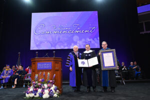 During the morning Commencement, HPU President Nido Qubein presented an Honorary Doctor of Professional Leadership degree to Rev. Chris Hodges, the founding and senior pastor of Church of the Highlands, which has established around 30 campuses across the state of Alabama since it began in 2001.