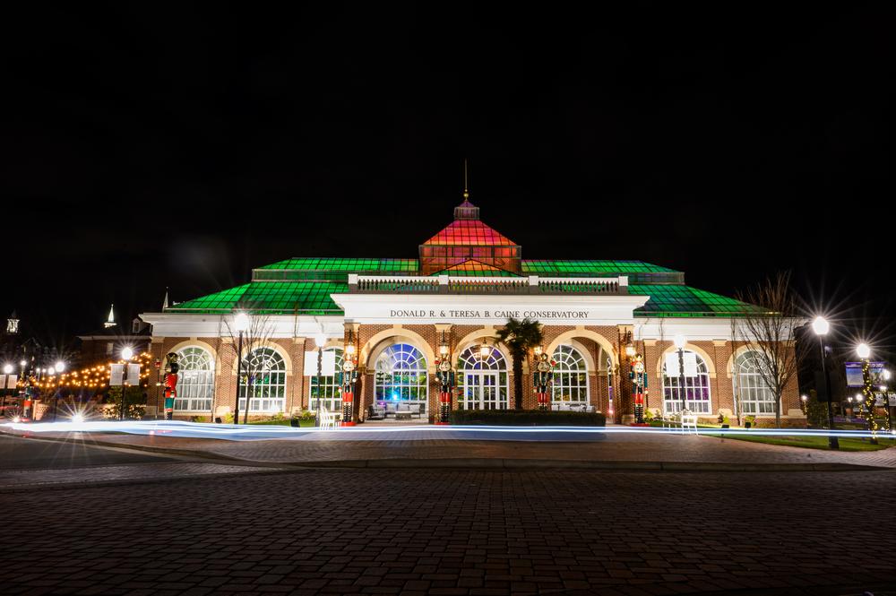 HPU's Caine Conservatory is lit up in red and green.