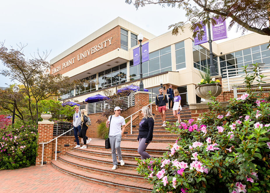 High Point University students walk down steps on campus, reflecting the three No. 1 rankings that HPU received from the U.S. News & World Report.