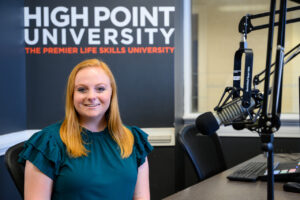 Madelyn Mudd headshot in the podcast studio