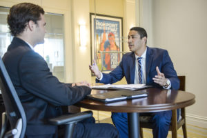 Senior Vincent Perez practices his sales pitch in the Harris Sales Center. Perez has accepted a position as an Account Executive for Gartner in Fort Myers, Florida.