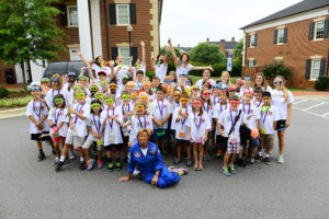 HPU STEM Camp participants, HPU graduate students and Disseler, are featured at the rocket launch for the first-ever HPU STEM Camp last summer.