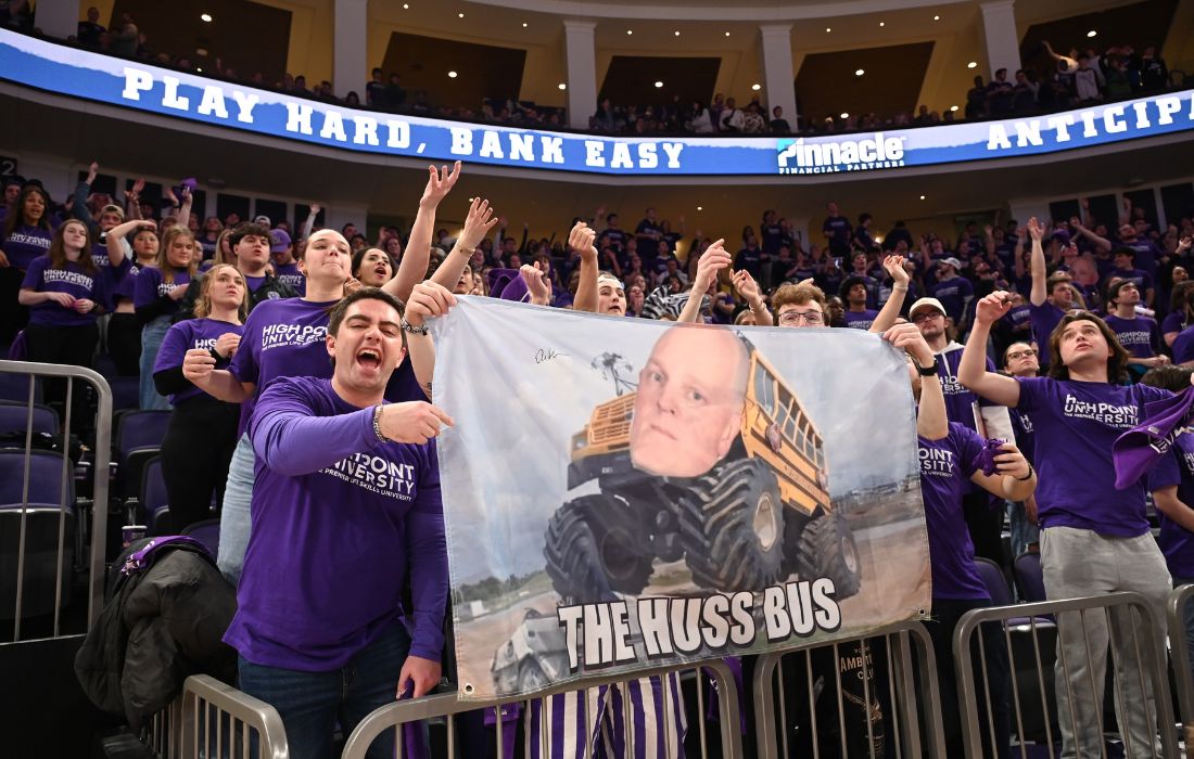students with banner the huss bus hpu basketball espnu game