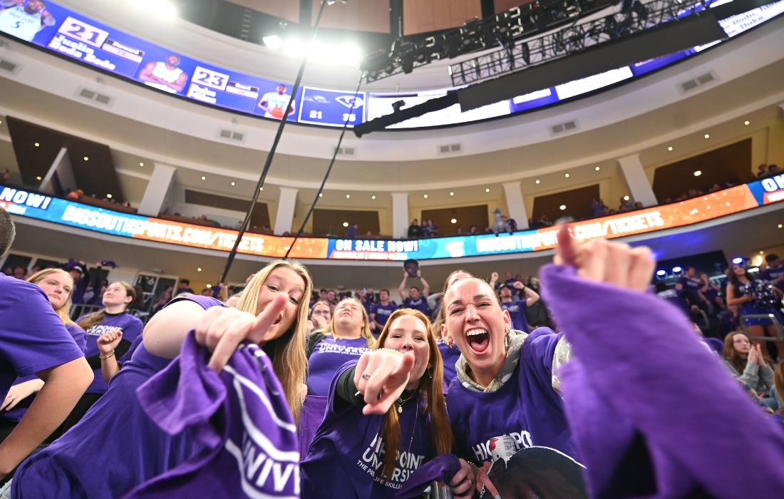 women students cheering at hpu espnu basketball game