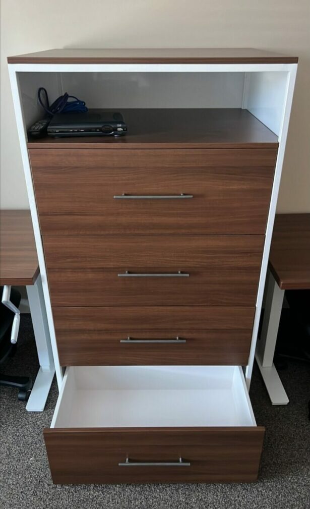 Drawers with open shelf in dorm room